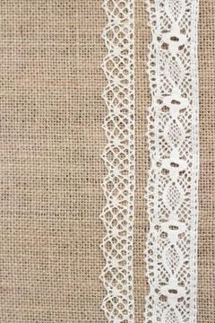 Burlap background with lace Stock Photos