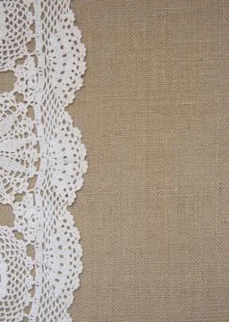 Burlap background with lace Stock Photos