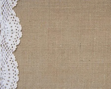 Burlap background with lace Stock Photos