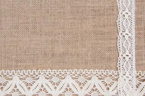 Burlap background with lace Stock Photos