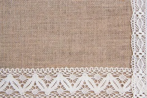 Burlap background with lace Stock Photos