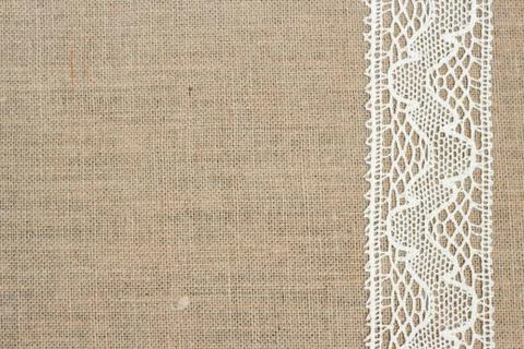 Burlap background with lace Stock Photos