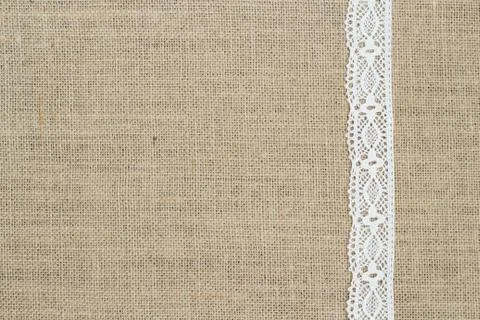 Burlap background with lace Stock Photos