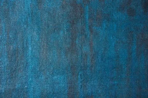 Burlap background painted with colored paint in blue Stock Photos