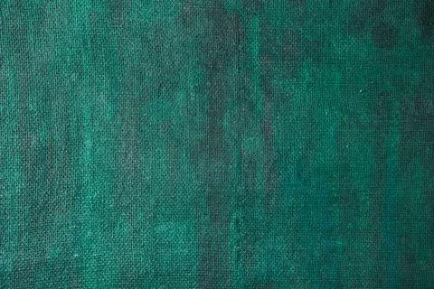 Burlap background painted with colored paint in turquoise color Stock Photos