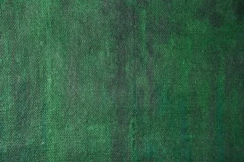 Burlap background painted with colored paint in green color Stock Photos