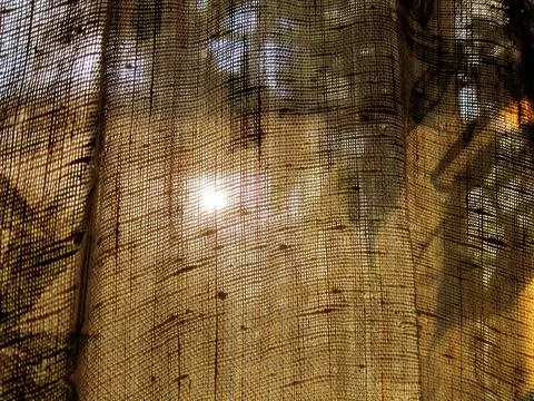 Burlap fabric texture abstraction with translucent light defocus Stock Photos