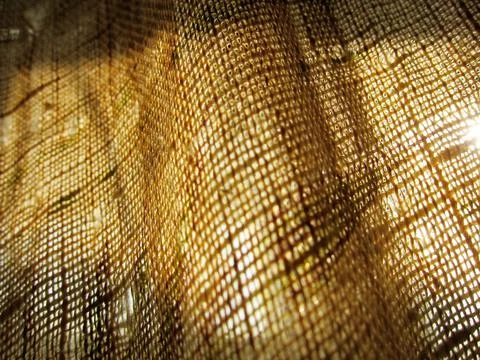 Burlap fabric texture abstraction with translucent light defocus Stock Photos