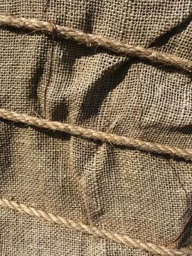 Burlap fabric twisted rope rustic texture composition Stock Photos
