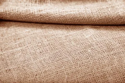 Burlap pleated texture as background. Stock Photos