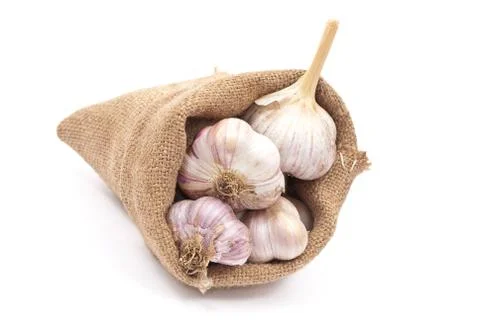 Burlap sack with garlic Stock Photos