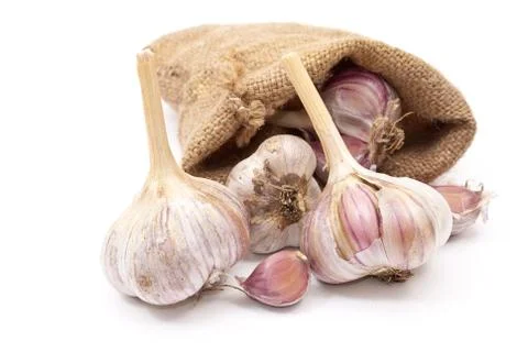 Burlap sack with garlic Stock Photos