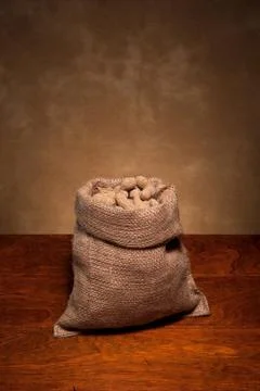 Burlap sack of peanuts Stock Photos