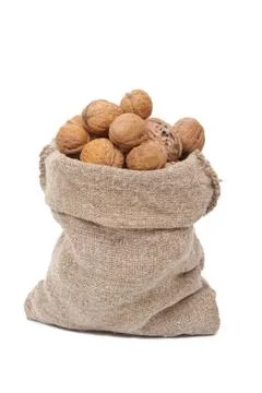 Burlap sack with walnuts Stock Photos