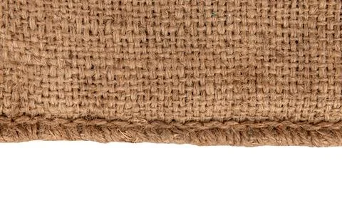 Burlap texture. A piece of torn burlap on a white background. Canvas. Packi.. Stock Photos