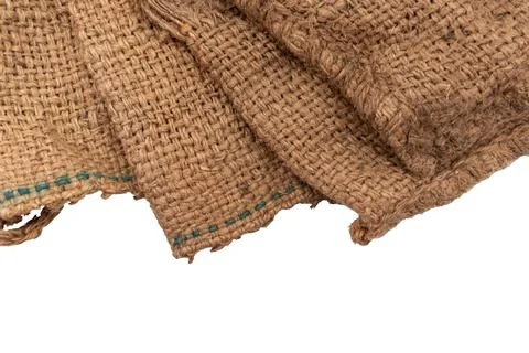 Burlap texture. A piece of torn burlap on a white background. Canvas. Packi.. Stockfoto's