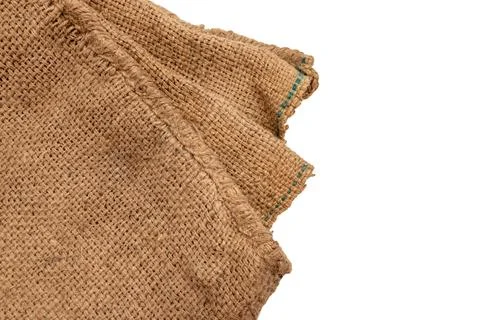 Burlap texture. A piece of torn burlap on a white background. Canvas. Packi.. Stock Photos