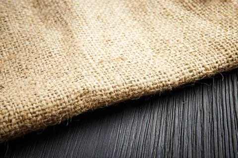 Burlap texture on wooden table background Stock Photos