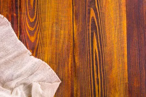 Burlap texture on wooden table background. Stock Photos