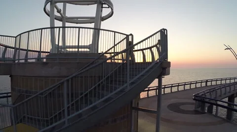 Burlington Pier frame left, capturing sunrise via Drone flying to the right Stock Footage 55262143