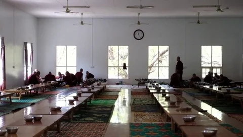 Burma, Bagan, March 2017. Monks having lunch Stock Footage 80655877
