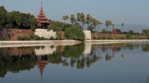 Burmese buildings reflected in lake Stock Footage 102640711