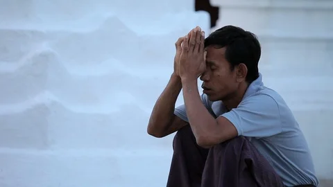 Burmese man praying in temple, Myanmar Stock Footage 102634874