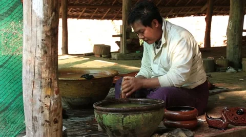 Burmese man working in a factory of lacquer. Bagan, Myanmar, Burma Stock Footage 61729201