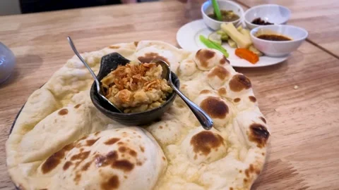 Burmese Naan Flatbread Served with Boiled Chickpea Dip Stock Footage 345470836