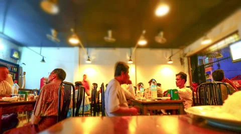 Burmese people relaxing in evening at beer bar. Yangon, Myanmar. Time lapse Stock Footage 59695995