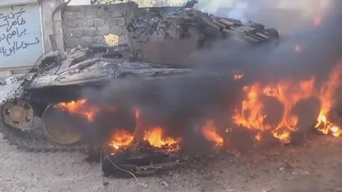 Burn destroyed tank in the vicinity of the T-62 Aleppo Syria Stock Footage