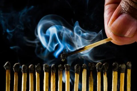 Burn match with smoke Stock Photos
