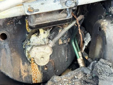 Burned air conditioning compressor valve from a car showing heat damage, me.. Stock Photos