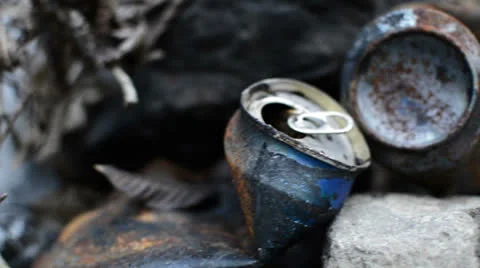 Burned beer cans slide right Stock Footage 24849298