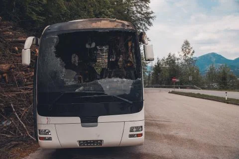 Burned bus on the highway in Austria Stock Photos