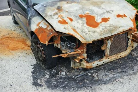 Burned car parked Stock Photos