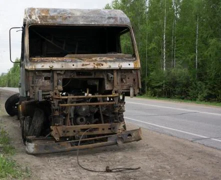 Burned car on the roadside Stock Photos