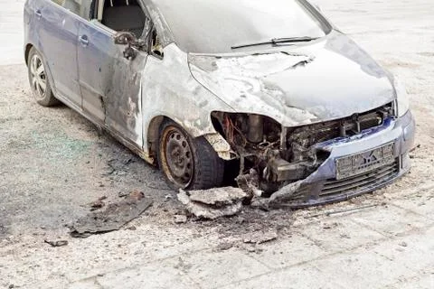 Burned car in the street Stock Photos
