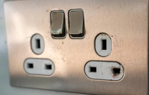 Burned electrical power socket, unsafe wall power socket Stock-Fotos