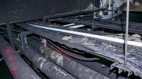 Burned Electrical Wiring in Building Ceiling Stock Photos