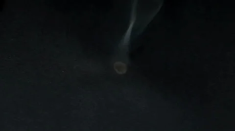 Burned hole on a black background Stock Footage 36438294