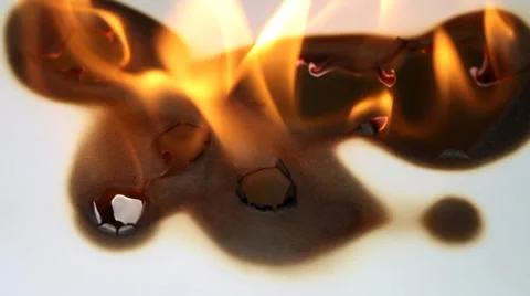 Burned hole on a white background Stock Footage 36437438