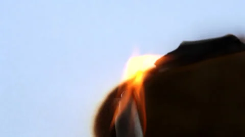 Burned hole on a white paper background Stock Footage 35569864