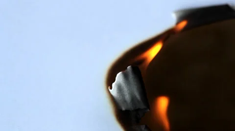 Burned hole on a white paper background Stock Footage 35570109