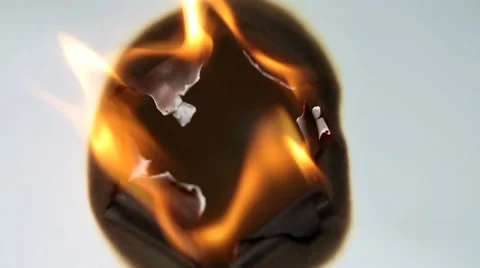 Burned hole on  white paper background Stock Footage 36437696