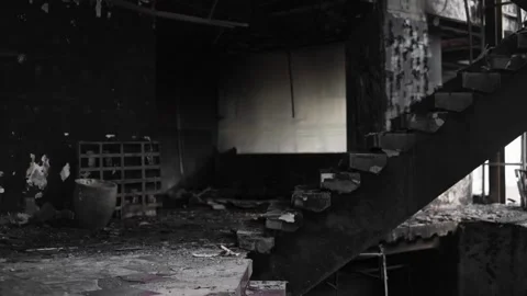 Burned interior room showing damaged staircase Stock-Footage 345860496