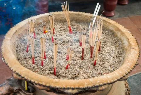 Burned joss stick in the pot Stock Photos