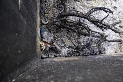 Burned metal cans in garbage container, recycling and environment Stock Photos