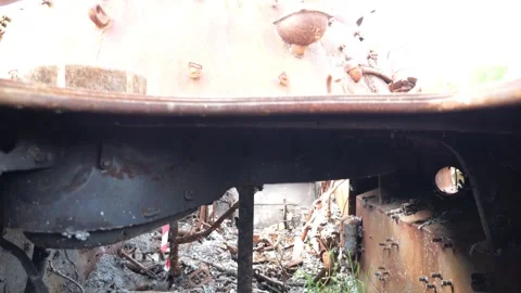 Burned-out and rusty russian armored vehicles displayed at an outdoor exhibition Stock Footage 345265142