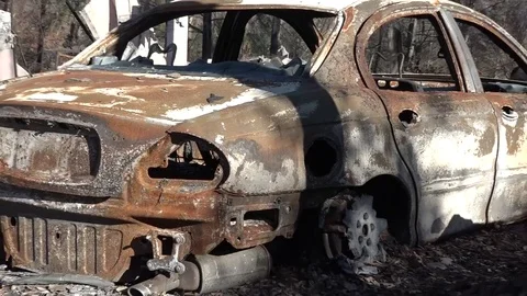 Burned out car surrounded by ash after Sonoma fires Stock Footage 84669976